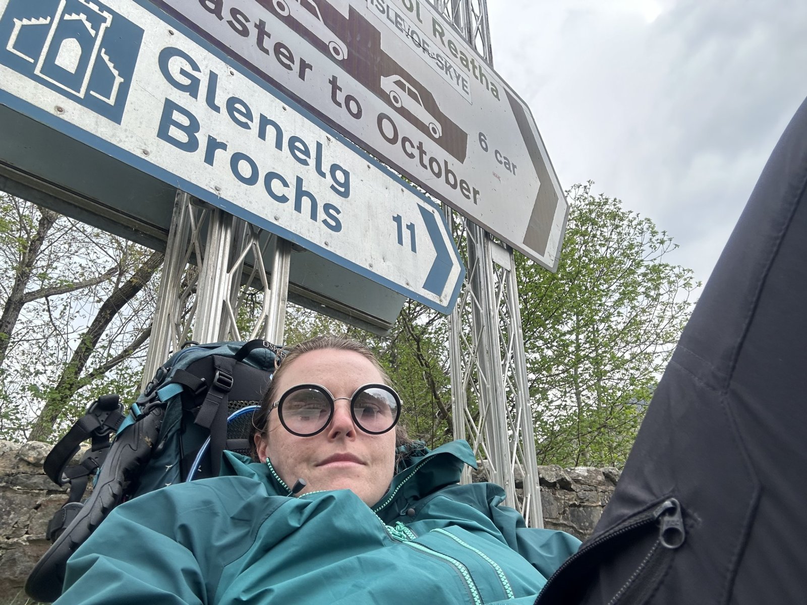Hiker waiting for the bus in Shiel Bridge on the Cape Wrath Trail